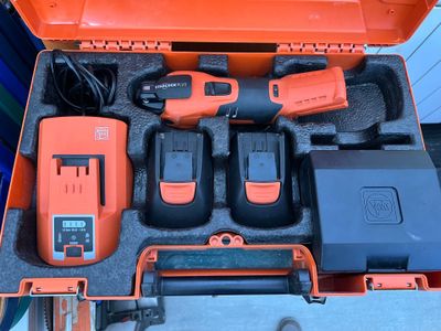 a tool kit in a case that is sitting on the floor