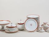 many plates and bowls that are sitting on a table