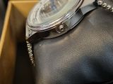 a watch that is sitting in a box on the table