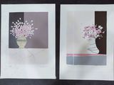 two prints of flowers in a vase on a table