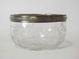 a glass jar with a lid on a white surface
