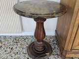 a small table that is on the floor in a room
