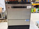 an image of a stainless steel ice machine in a warehouse