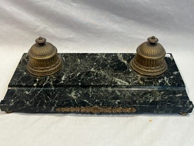 pair of antique brass candles on a marble base