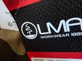 the back of a pair of black and red running shoes with the label on it