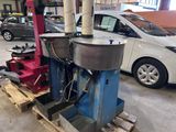 a machine that is sitting on a pallet in a garage