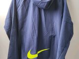 blue jacket with yellow nike logo on it hanging on a hanger