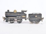 two toy trains sitting side by side on a white surface