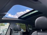 a view of the sunroof from inside of a car