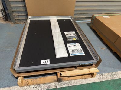 a large metal box with a black and white label on it