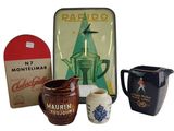 three different types of coffee mugs and a box