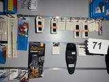 a refrigerator with a bunch of items hanging on the wall