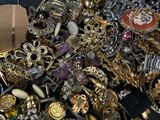 a large pile of assorted jewelry on a table