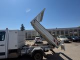 a white truck that is parked in a parking lot