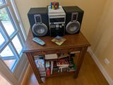 a small table with a stereo system on top of it