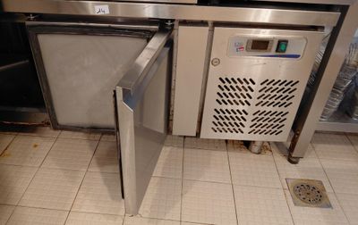 an image of a kitchen with a refrigerator and a dishwasher