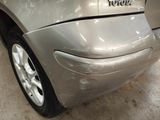 a close up of a car that has a denting on it