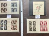 several different types of stamps on display in a glass case