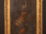 un tableau représentant un homme portant un casque et tenant une épée