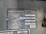 a close up of a metal sign on the side of a vehicle