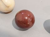 three balls that are sitting on a table