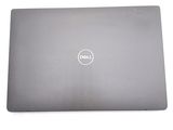the back of a dell laptop with its lid open on a white surface