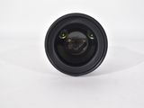 the lens of a camera is shown on a white surface