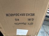 a cardboard box that is sitting on the ground