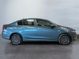 a blue car is parked in a room with a gray floor
