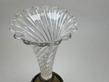 a glass vase that is sitting on a table