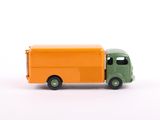 a toy truck that is sitting on a white surface