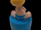 toy figurine of a baby sitting on top of a blue barrel