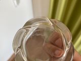 a person holding a glass of water in their hand
