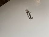 a white box sitting on a table next to a window