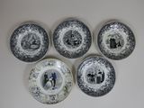 four plates with pictures of people on them on a white surface