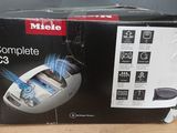 the box is open to show the contents of a computer mouse