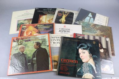 a lot of music books and cds on the table