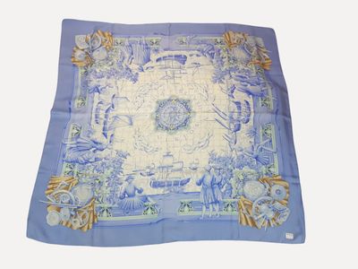 blue and white square scarf with a picture of a garden