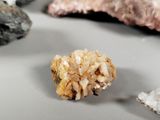 a small piece of rock sitting on a table next to other rocks