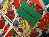 a pillow with a tag on it that says lucas burbertte