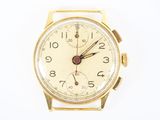 une montre en or avec un cadran blanc et une trotteuse rouge