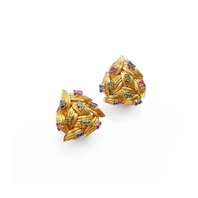 a pair of gold earrings with multi colored stones