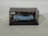 an image of a blue toy car in a clear display case