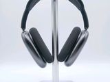 a pair of headphones on a stand on a white surface