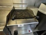 a grill that has a grill on it in a kitchen