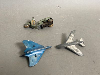 two toy airplanes sitting next to each other on a table