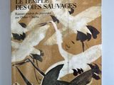 un livre avec une illustration d'oiseaux volant dans le ciel
