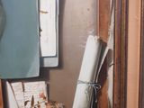 a picture of a vase with flowers and papers on a table