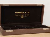 an image of a wooden box with a cigar in it on a table