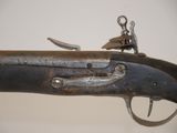 an old gun that is on display in a museum